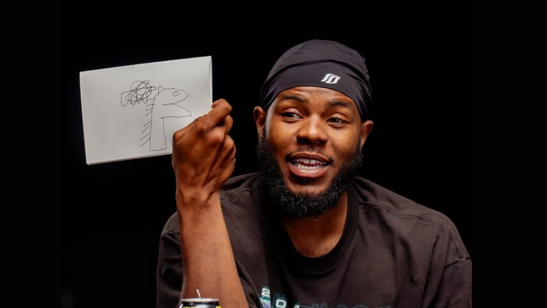 Chris from AMP's "Extreme Pictionary" video (Image via @ampexclusive/Instagram)